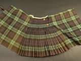 plaid pleated skirt with buttons on the front and bottom of the skirt