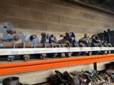 many pairs of shoes on a shelf in a room