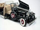a model of a black car with its hood open