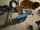 a picture of a trailer with a fork attached to it in a garage