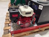 a picture of a red and white engine and a green and white tank on a pallet