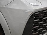 a close up of the front of a white car