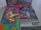 a lot of vinyl records on the table in the room