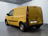 the yellow van is parked in the large room of the building