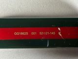 a green and red belt with a red stripe on it