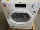 an image of a washing machine sitting on a pallet in a warehouse