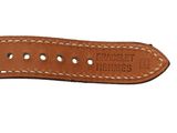 a close up of a brown leather watch strap with white stitching