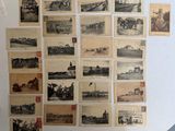 de nombreuses vieilles photos accrochées au mur d'une pièce