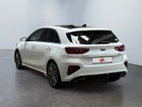 the rear end of a white car in a white room