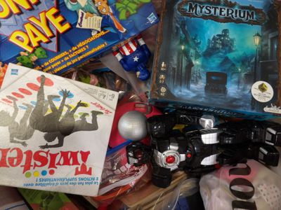 a pile of toys and games on the floor