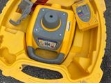 a yellow case with tools inside of it on the ground