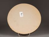 an image of a plate on a stand with a sticker on it
