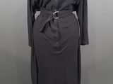 an image of a black dress with a belt on a mannequin