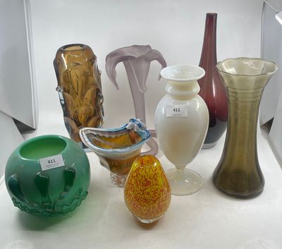many vases that are sitting on a white table