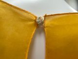 an image of a close up of a yellow dress on a mannequin mannequin