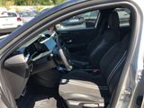 the interior of a car with the driver ' s seat folded down