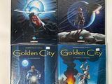 three golden city books on a white surface