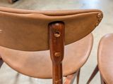 two chairs that are in a room with a lot of furniture