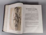 an open book with a drawing of a castle in the middle of it