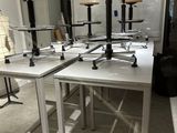 a room with tables and stools in it