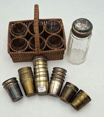 a basket of salt and pepper shakers next to a basket of salt and pepper shakers