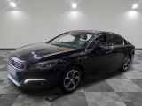 a picture of a black car in a showroom