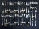 a lot of spoons and spoon spoons on a table