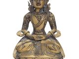 a gold statue of a buddha sitting on a lotus position