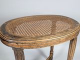 an old wooden table with a rattan top on a white background