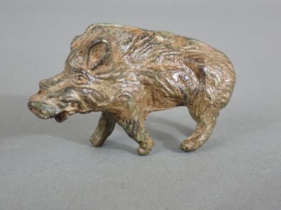 a figurine of a boar on a table