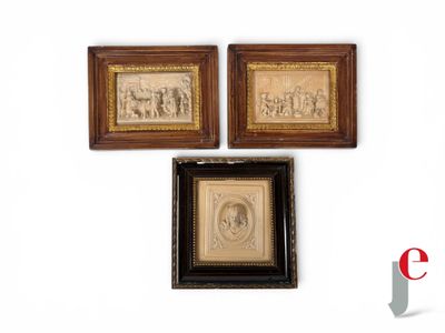 two framed pictures of a man and a woman on a wall