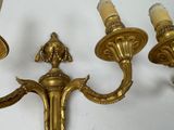 three candles that are on the wall next to each other