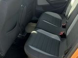 the interior of a car with the door open showing the front seats