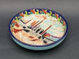 a bowl with a picture of a city on it