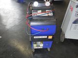 une machine posée sur le sol du garage