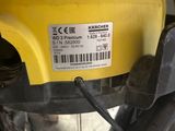 a close up of a yellow vacuum cleaner on a table