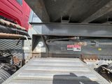 a flatbed truck with a flat bed on the back of it