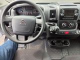 dashboard view of a car with a steering wheel and dashboard controls