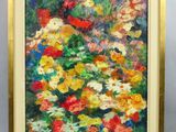 un tableau représentant un bouquet de fleurs dans un cadre doré