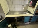 an image of a kitchen with a sink and a stove