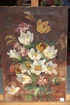 a picture of a painting of flowers on a easel