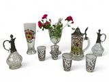 many different vases and vases with flowers in them