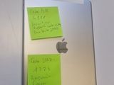 two sticky notes attached to the back of an ipad