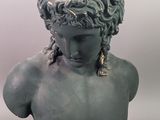 a statue of a man with a head of hair on it
