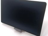 a laptop computer sitting on a stand on a white surface