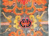 an old rug with a colorful design on it