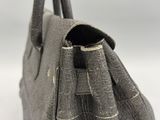 the inside of a gray purse with a zipper on it