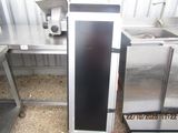 a silver refrigerator sitting in the middle of a kitchen