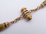 gold plated necklace with tassels and beads on a chain