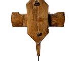 an old wooden cross on a stand on a white background
